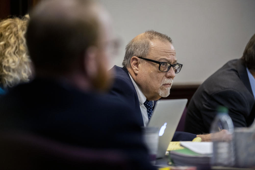 Greg McMichael, center, listens to his attorney Bob Rubin, right, during his trial in the Glynn County Courthouse, Tuesday, Nov. 16, 2021, in Brunswick, Ga
