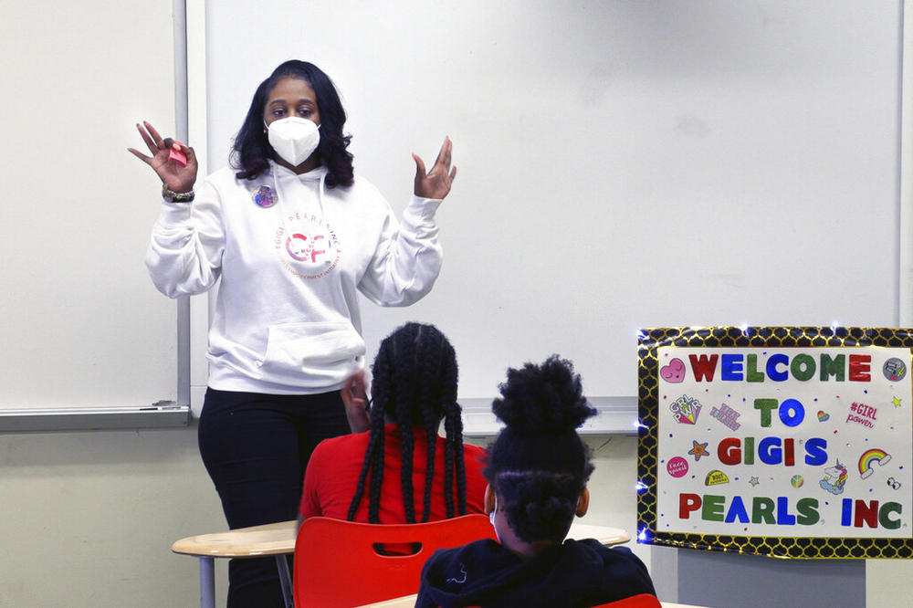 Shameika Averett, founder of Gigi's PEARLS, Inc., speaks with students at Dorothy Height Elementary School on Jan. 14, 2022, in Columbus, Ga. Six years after her daughter, mother and brother were murdered in a triple homicide, Averett created the nonprofit organization to help Columbus area girls become successful women who are constructive citizens in their community — and don’t tolerate violence.