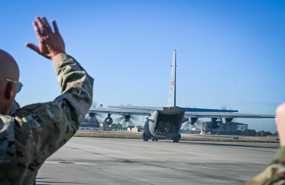 Waving to 165th Airlift Wing members deploying to Europe