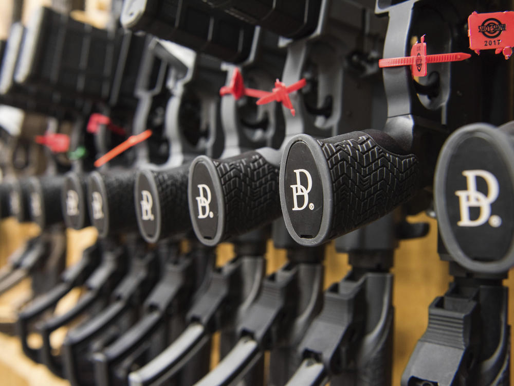In this March 9, 2017, photo a row of AR-15 style rifles manufactured by Daniel Defense sit in a vault at the company's headquarters in Black Creek, Ga.