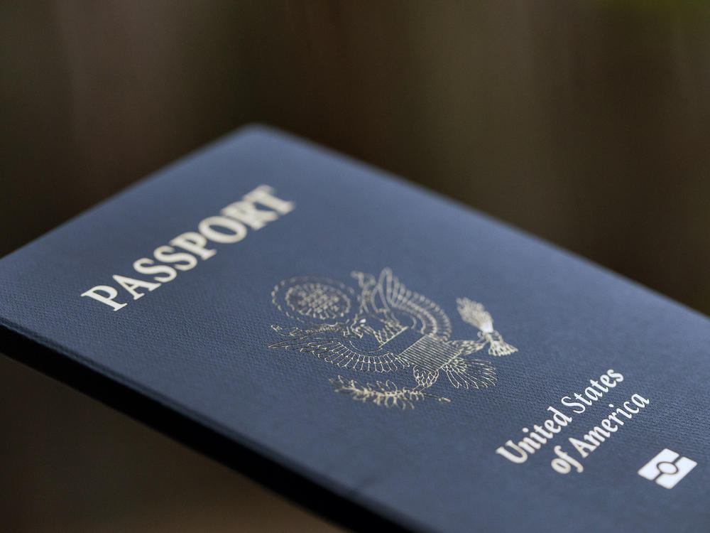 The cover of a U.S. Passport is displayed in Tigard, Ore., Saturday, Dec. 11, 2021.