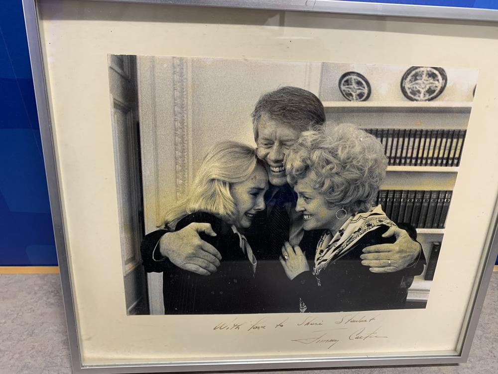 Jimmy Carter hugs Sheri Mann Stewart (left) and Connie Stewart (right) in this undated photo.