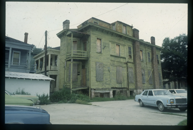 A photo taken of the building that sat at 115 West Waldburg Street sometime in the 1970s-80s. Two Victorian homes similar to the one above were taken down to build the mid-century modern style building that property owner David Paddison wants to demolish there now.