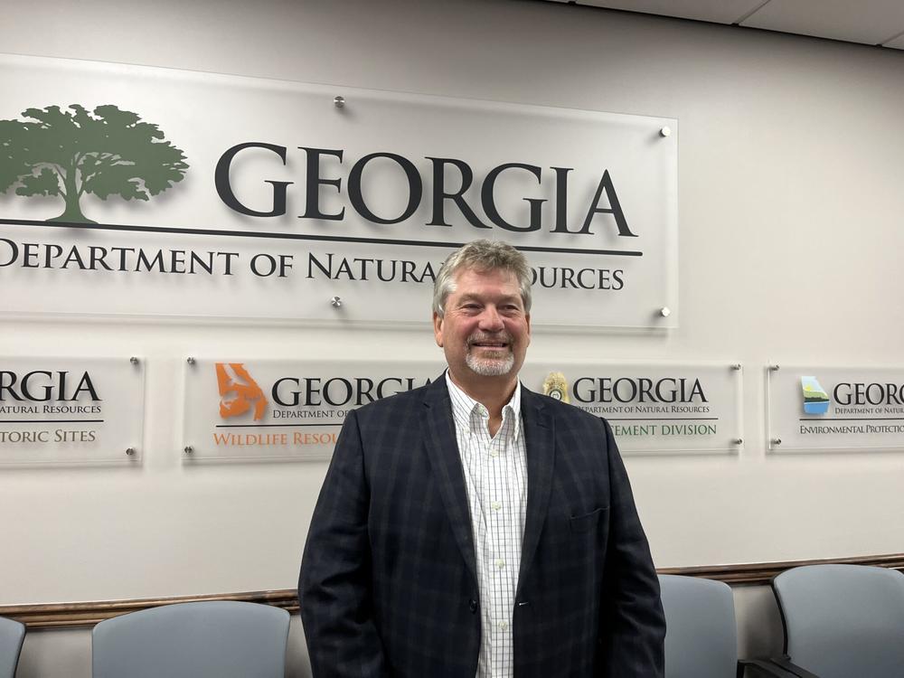 Jeff Cown, the incoming director of the state Environmental Protection Division, poses for photos Wednesday after being confirmed by the Board of Natural Resources during a special called meeting. 