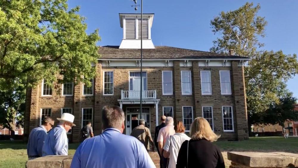 The Macon-Bibb delegation visits the 1878 Creek Nation Council House in downtown Okmulgee, Oklahoma, during the 2023 Ocmulgee to Okmulgee Tour. (Liz Fabian)