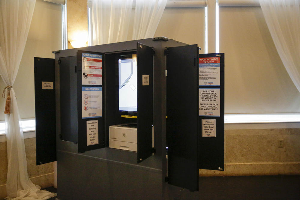 New state-issued voting machines used for the Georgia primary election on June 9, 2020, are seen at Park Tavern in Atlanta. U.S. District Judge Amy Totenberg issued a 135-page ruling late Friday, Nov. 10, 2023 in a long-running lawsuit filed by activists who want the state to ditch its electronic voting machines in favor of hand-marked paper ballots.