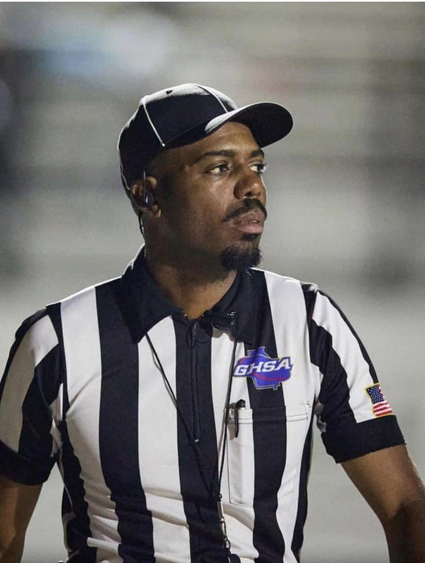 Darrius Stephens is shown in a referee's uniform.