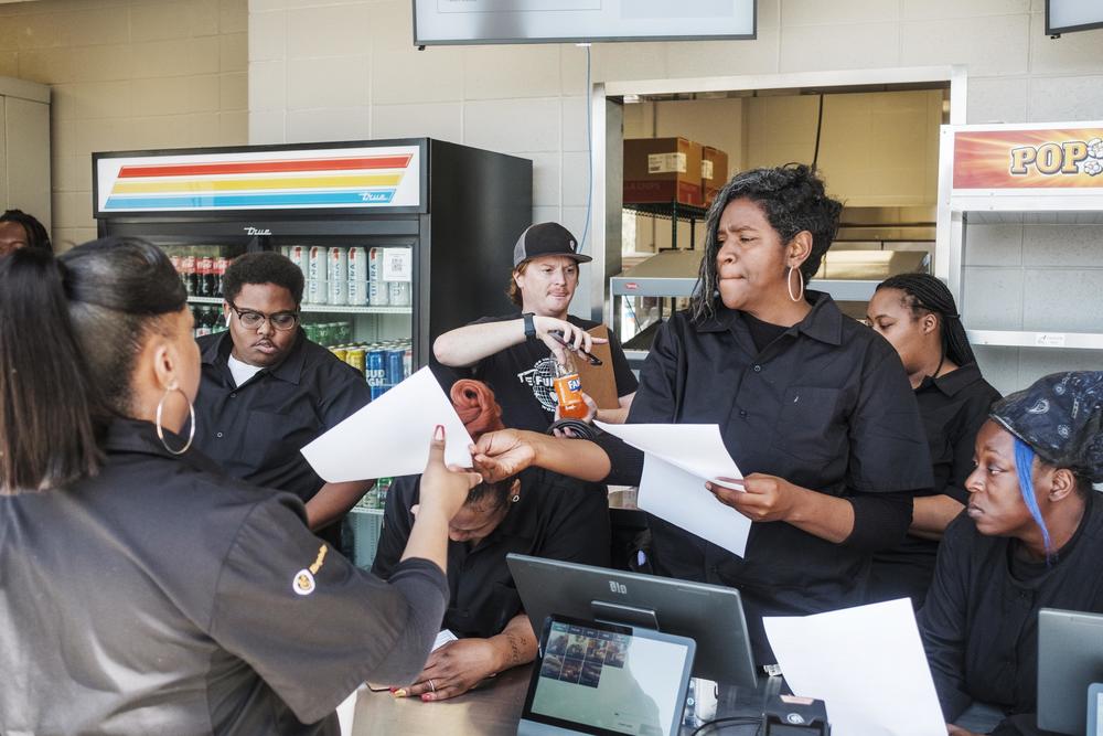 Concession workers handle last minute logistics before doors open to hungry and thirsty concert goers. 