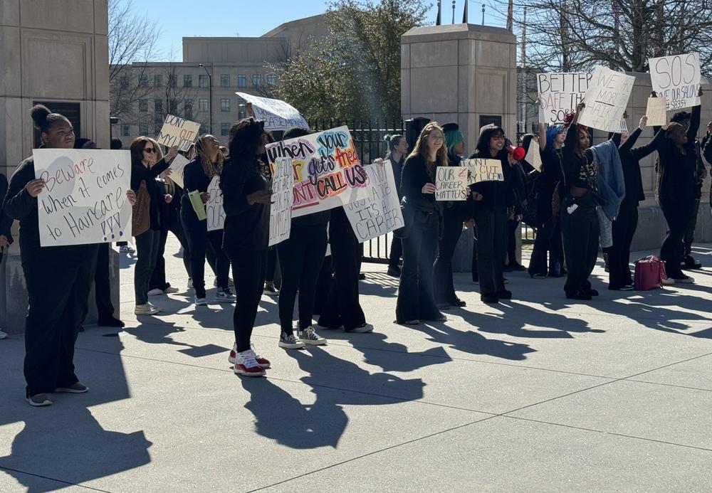 Cosmetologists demonstrated at the state Capitol in February 2024 in protest of a bill that would do away with the state some licensing requirements.