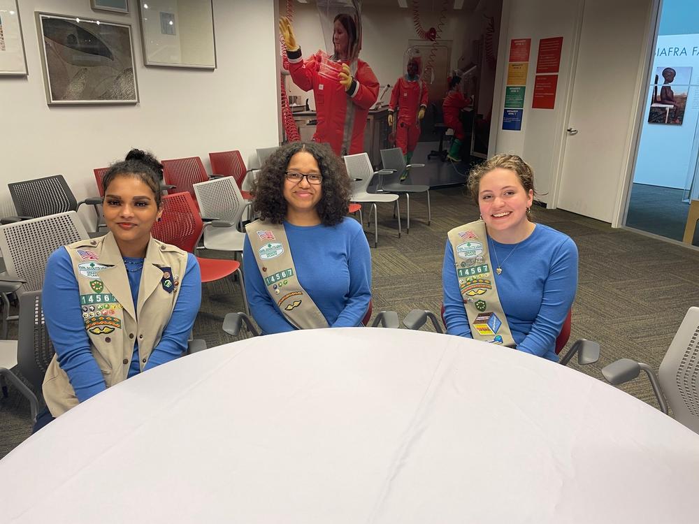 Leslie Lutz, Gnouma Fofana and Lily Crick seated at a table