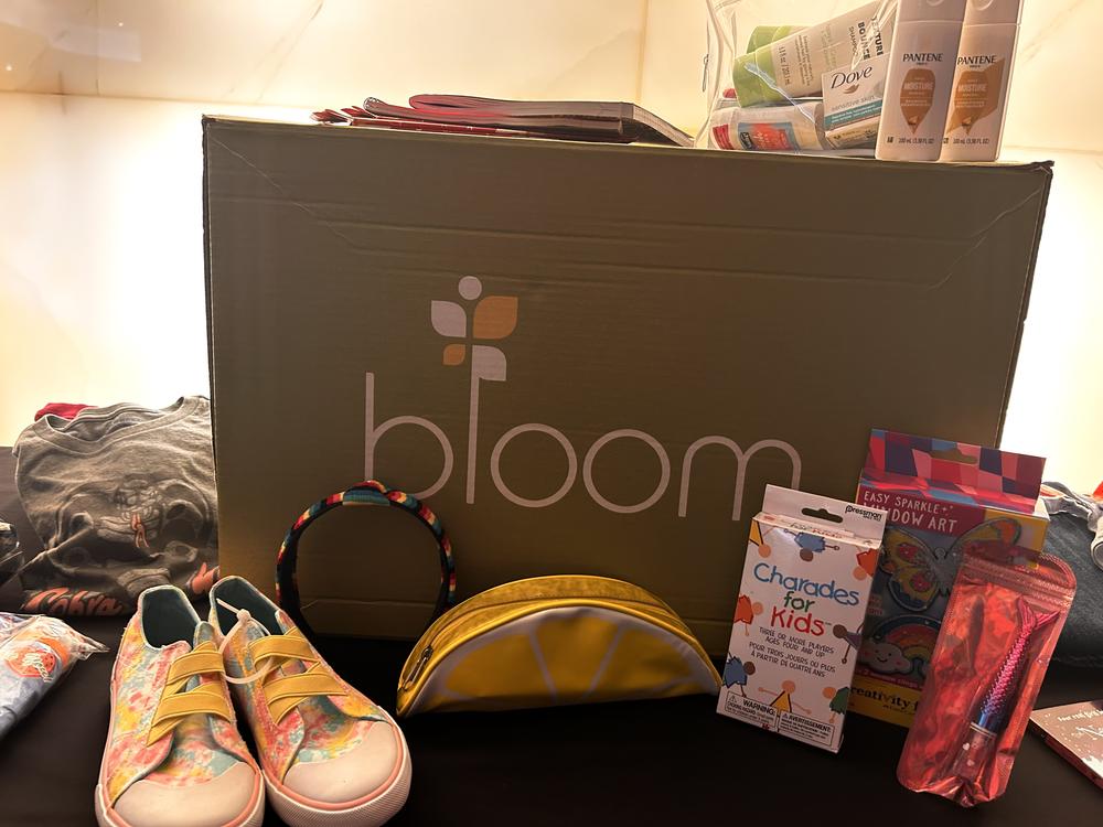 Bloom Our Youth boxes full of personal care items and more for kids.