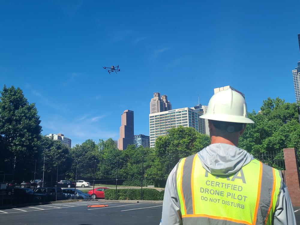 A drone pilot with Georgia Power demonstrates how the technology is used to take pictures in hard to reach areas during an emergency.