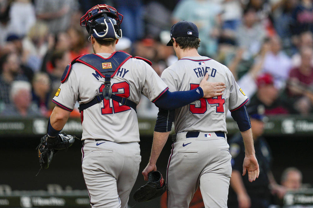 Atlanta Braves catcher Sean Murphy (12) and starting pitcher Max Fried (54) walk to the dugout during the fifth inning of a baseball game against the Baltimore Orioles, Tuesday, June 11, 2024, in Baltimore. (AP Photo/Jess Rapfogel)