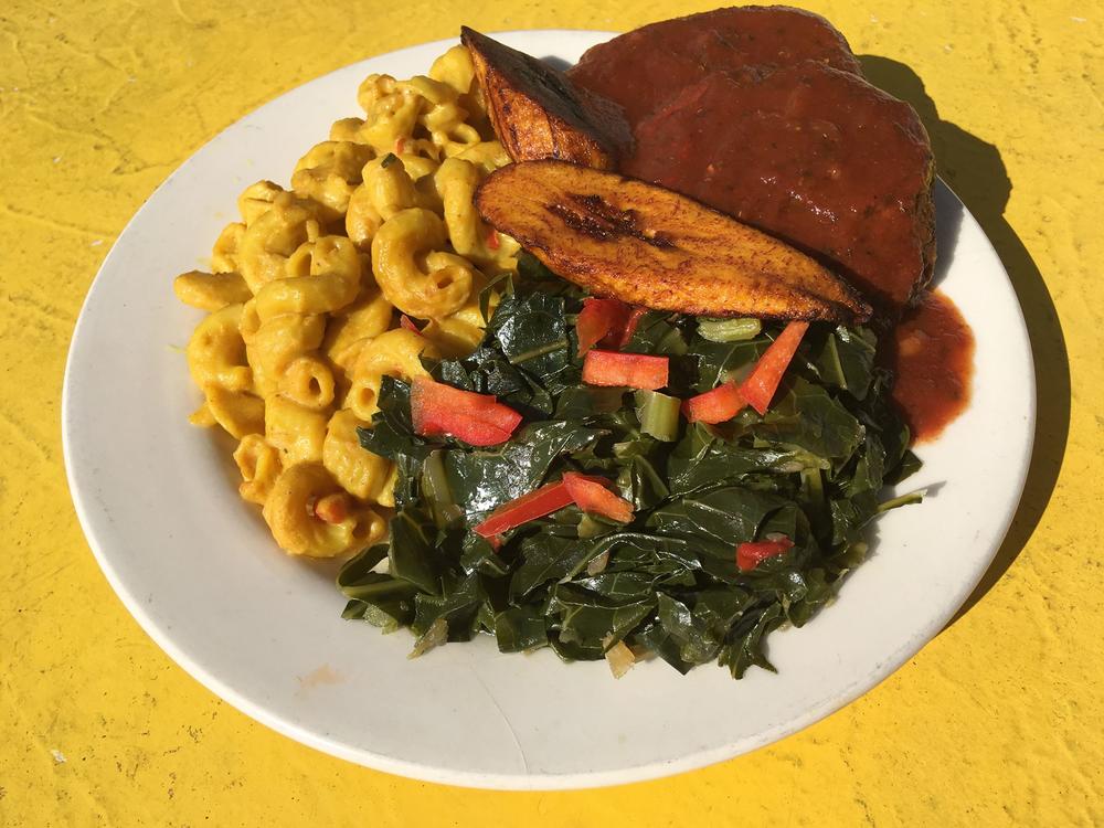 Chickpea patties, mac un-cheese made with cashew milk, collard greens, and plantains. (Provided by Healthful Essence)