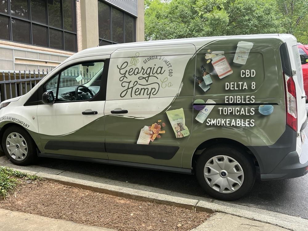 The Georgai Hemp Company van advertises products the business sells outside of a location in Sandy Springs. 