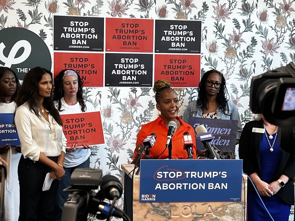 Former Atlanta mayor Keisha Lance Bottoms (in red), flanked by Biden campaign supporters including writer and model Padma Lakshmi (second from left) spoke at the Lola in Midtown Atlanta on Monday, June 24, 2024.