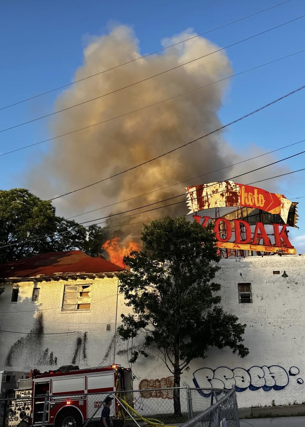 Fire engulfs the back portion of the historic Kodak and Atlanta Eagle buildings in Midtown. (Photo courtesy Midtown Neighbors Association)