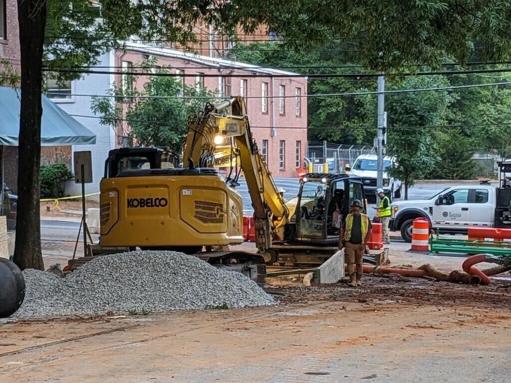 Repairs to a major water main in Midtown at 11th and West Peachtree streets were still underway on Tuesday morning, June 4. (Photo by Beth McKibben)