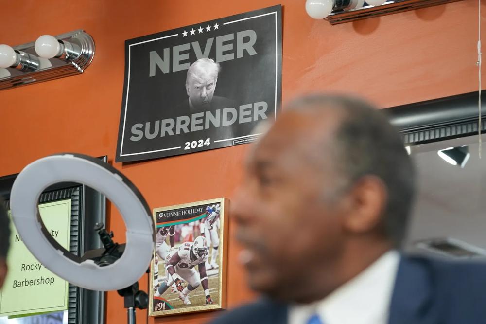 A sign on the wall inside Rocky’s barber shop. Photo by Julia Beverly/The Atlanta Voice