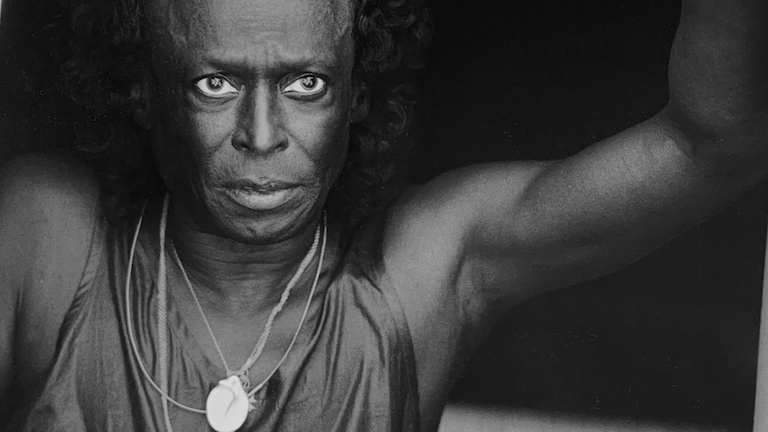 A black and white image of Miles Davis.