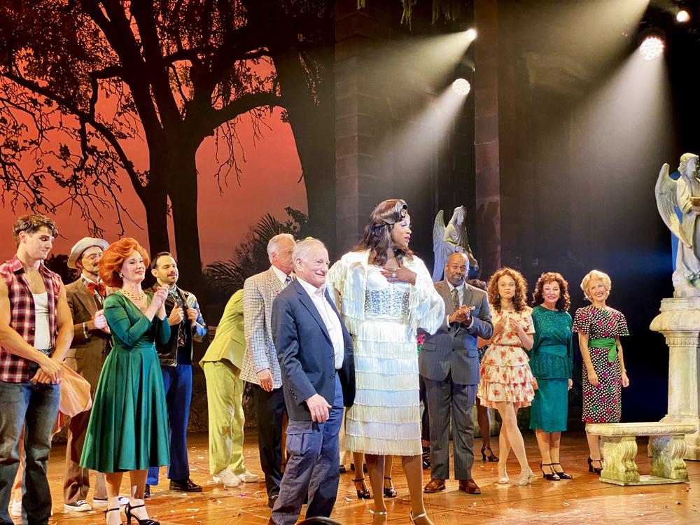 “Midnight in the Garden of Good and Evil” author John Berendt is brought onto the stage by J. Harrison Ghee after the opening night performance of the musical adaptation.