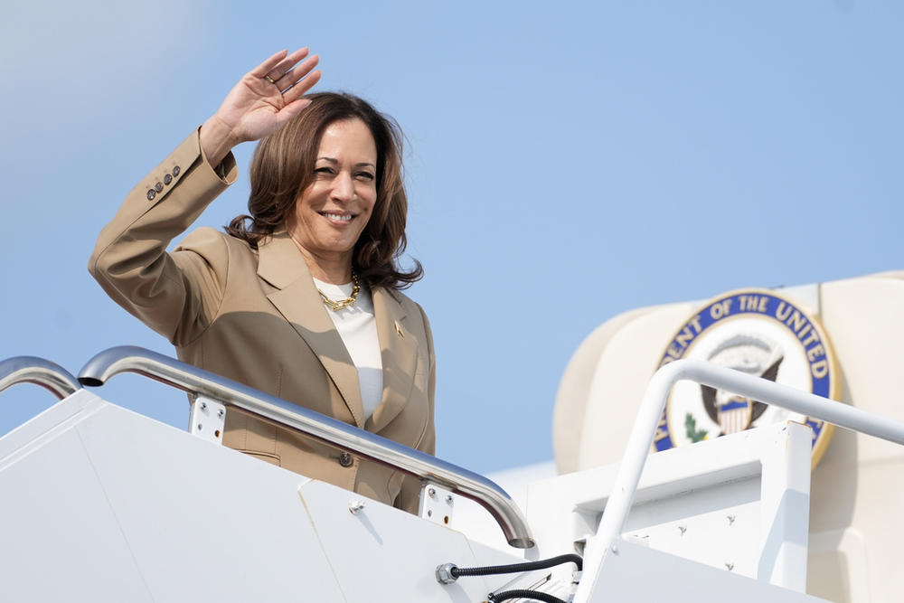 Vice President Kamala Harris waves while boarding Air Force Two as she departs Westfield-Barnes Regional Airport in Westfield, Mass., Saturday, July 27, 2024.