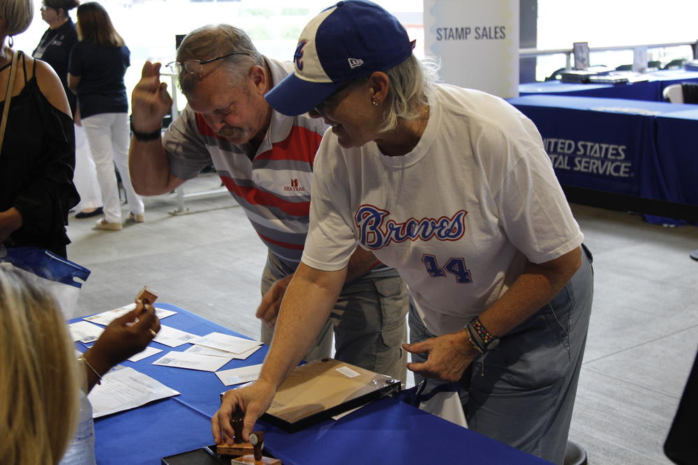 Kendall Xides of Decatur has her new Hank Aaron stamp cancelled.