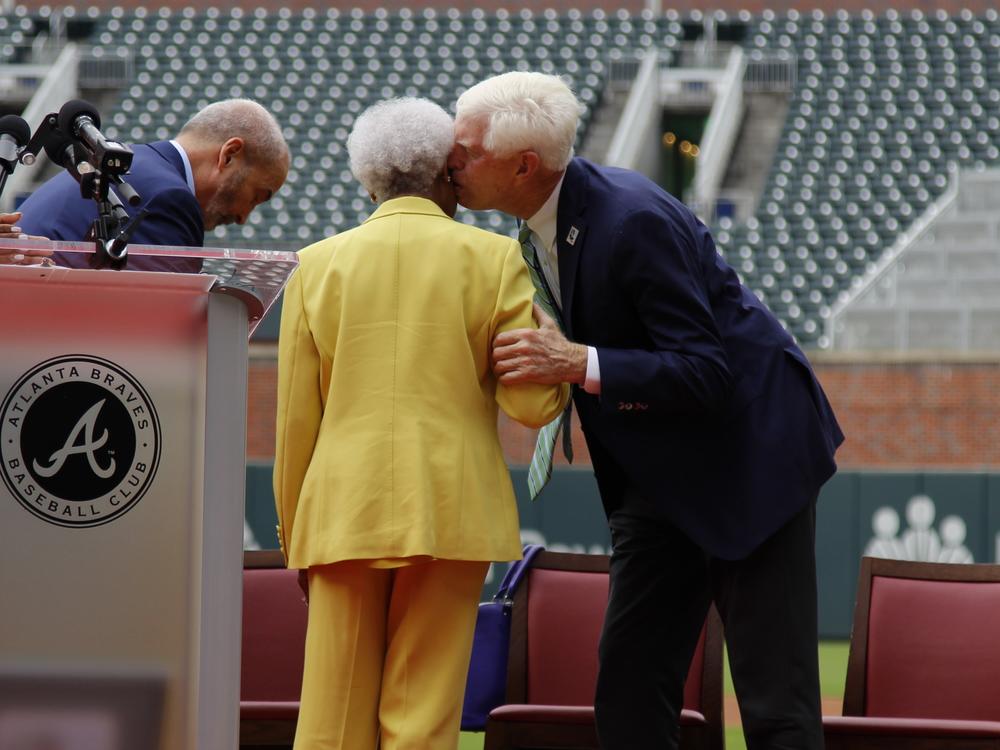 Terry McGuirk, chairman and CEO of Braves Holdings, greets Billye Aaron  at Truist Park in Atlanta on July 31, 2024. 