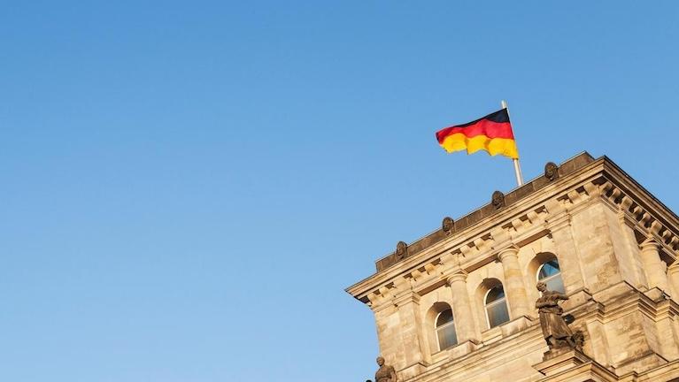 The German flag on top of a building.