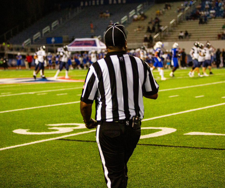 Referee at football game.