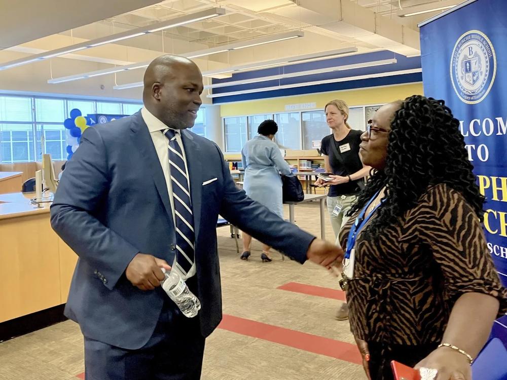 Atlanta Public Schools’ Superintendent Dr. Bryan Johnson speaks to a staff member at Ralph J. Bunche Middle School on Aug. 7. The new superintendent is visiting the district’s 87 schools during his first 100 days. (Photo by Dyana Bagby)