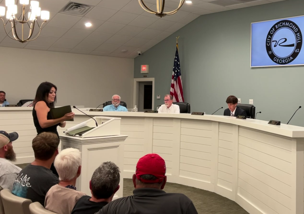 Richmond Hill resident Kristina Fredericks addresses the Richmond Hill City Council on Aug. 20, 2024, about flooding damage to her home and yard after Tropical Storm Debby.