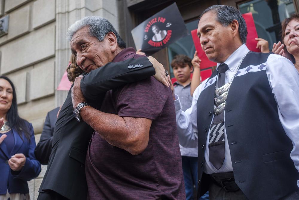 Flanked by Muscogee Nation Principal Chief David Hill, right, George Thompson, Mekko of the Hickory Ground Muskogee ceremonial ground, hugs Mary Kathryn Nagle after Nagle argued the side of Muscogee Nation before the federal 11th Circuit Court of Appeals in the long running dispute with the Poarch Band of Creek Indians from Alabama. 