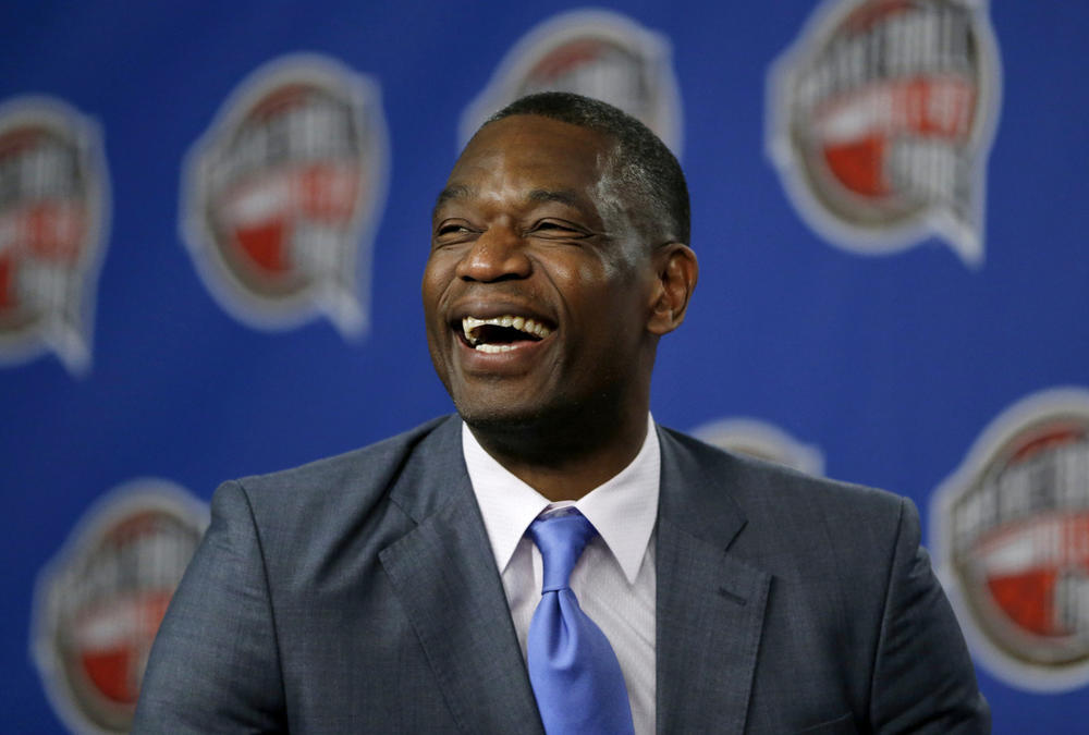 Former NBA basketball player Dikembe Mutombo laughs during a news conference announcing him as one of the 12 finalists of this year's hall of fame class during an event ahead of the NBA All Star basketball game, on Feb. 14, 2015, in New York. 