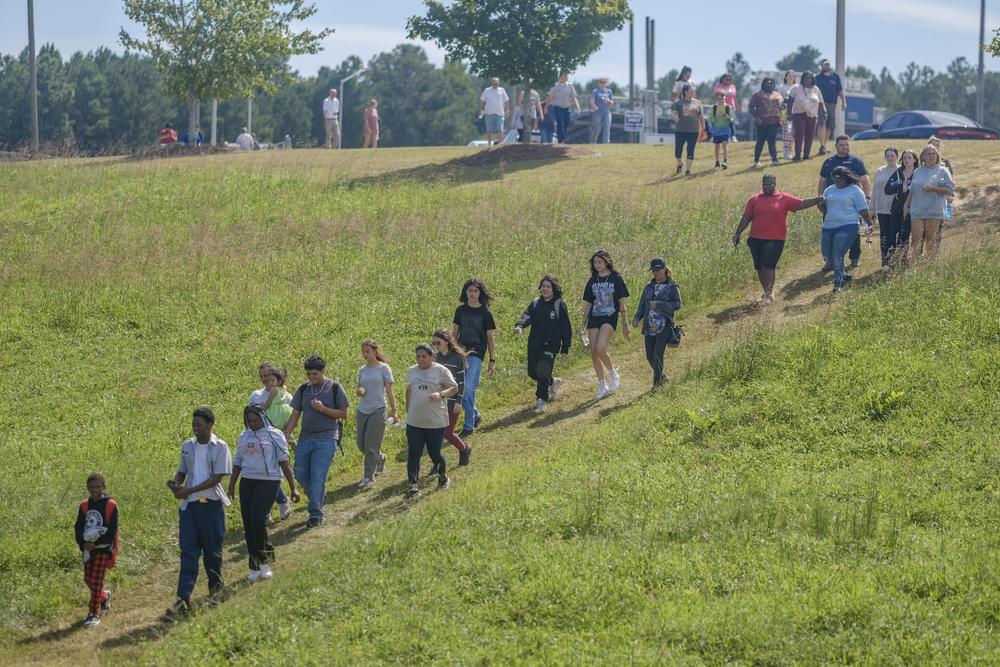 Students and parents file out of the campus of Appalachee HIgh School in Winder, Ga., after being released from lockdown following the school shooting there Sept. 4, 2024.