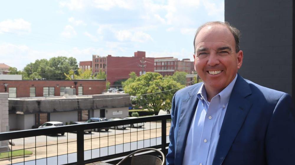 Ben Finley, 58, Attorney at The Finley Firm poses in front of his firm on 13th Street atop Nonic in Columbus, Georgia on Sept. 18, 2024. Kala Hunter