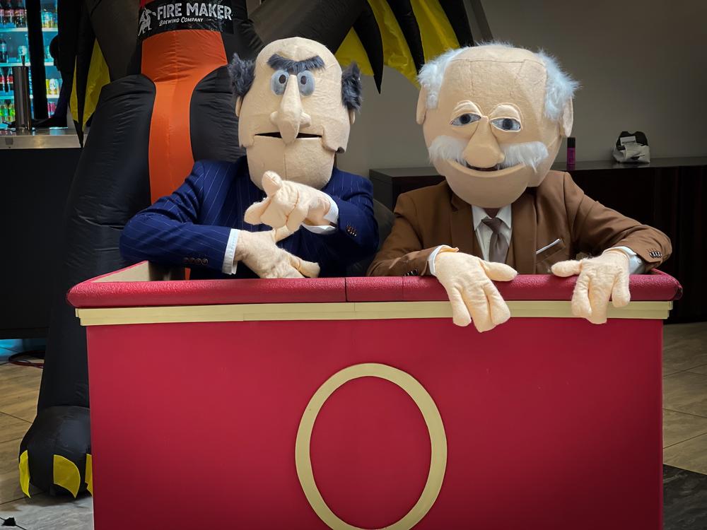 Dragon Con attendees cosplay as characters Statler (left) and Waldorf from "The Muppet Show" in 2024.