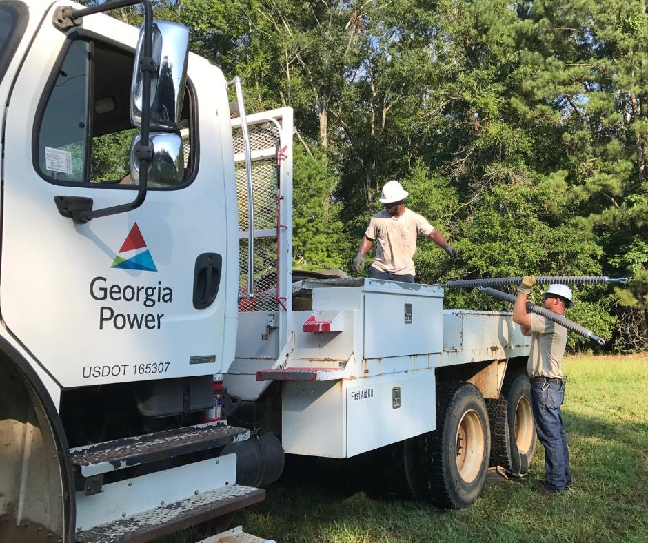 Georgia Power employees on truck. (Georgia Power/Facebook)