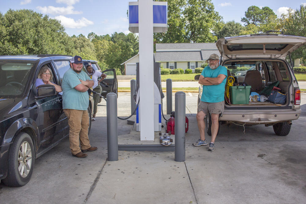 Brenda Welch, Michael Littleton and Rob Gross at a Marathon gas station in Sanderville on Friday, Sept. 27. All three said they struggled to find a functioning gas station in the aftermath of Hurricane Helene, which caused downed trees and other damage. As of late Friday afternoon, over 6,000 people were without power in Washington County.