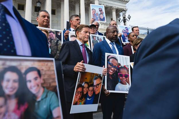 Sen. Raphael Warnock joined U.S. Senate Democratic colleagues on the steps of the U.S. Capitol to display families and individuals who have benefited from IVF treatment. Courtesy of Sen. Raphael Warnock