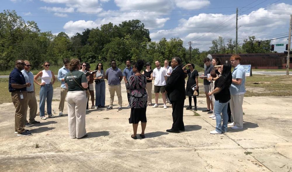 Kennesaw State University fifth-year architecture students listen to Macon leaders’ vision for the MLK Small and Minority-Owned Business District that encompasses the Greenwood Bottom Black business district. Liz Fabian/Macon Newsroom