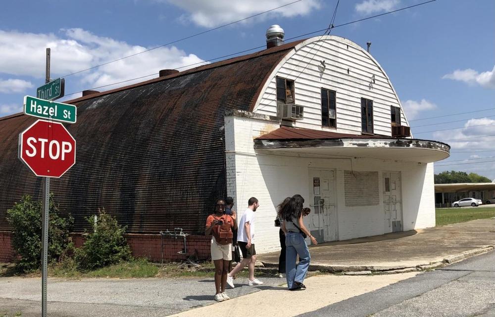 Kennesaw State University students take a closer look at the old Roxy Theater in the Greenwood Bottom Black business sector off MLK Jr. Blvd. Liz Fabian/Macon Newsroom