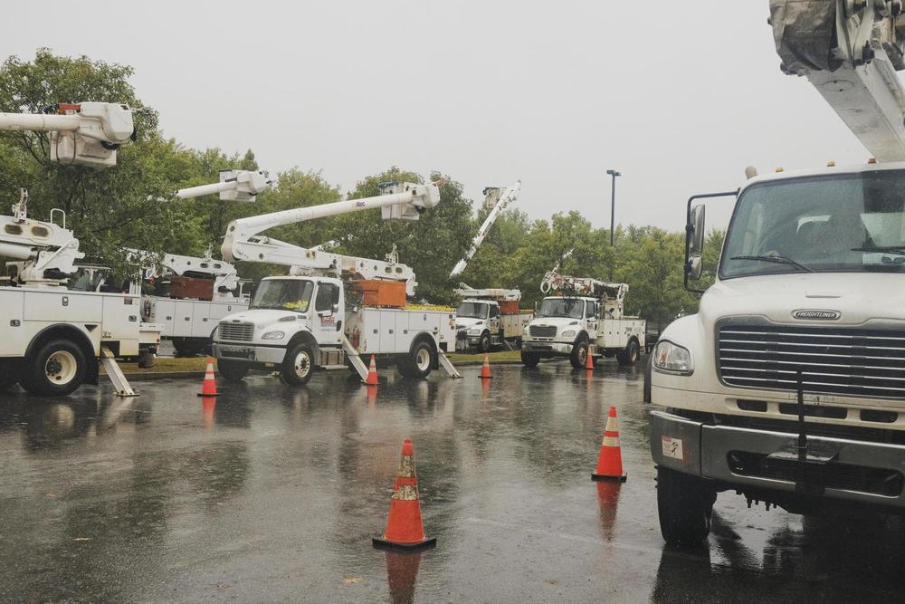 Out of state utility trucks waiting to be deployed amidst the severe weather. Grant Blankenship/GPB News