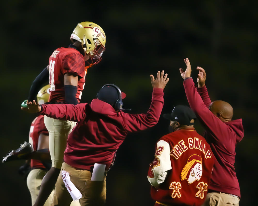 Creekside Seminoles celebrate a big play during their game.