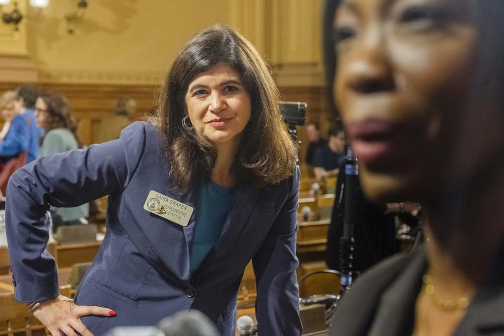 Georgia House Rep. Saira Draper listens as State Election Board member Janelle King speaks