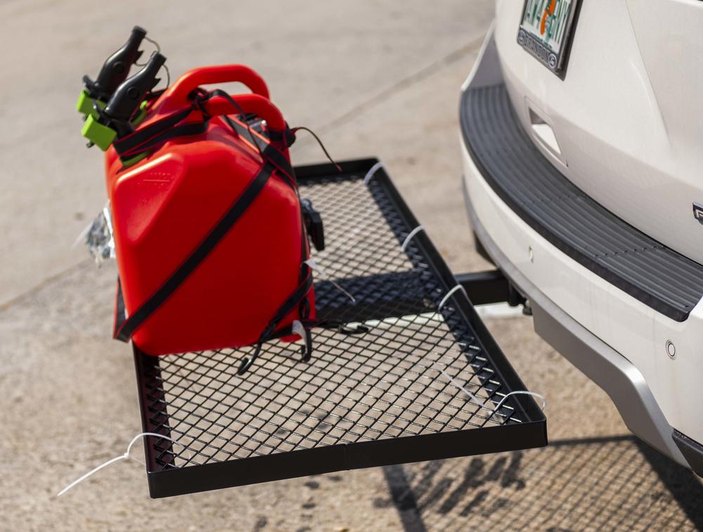 Fuel cans strapped to the back of an evacuating Florida family's SUV. in Macon on Oct. 8, 2024.