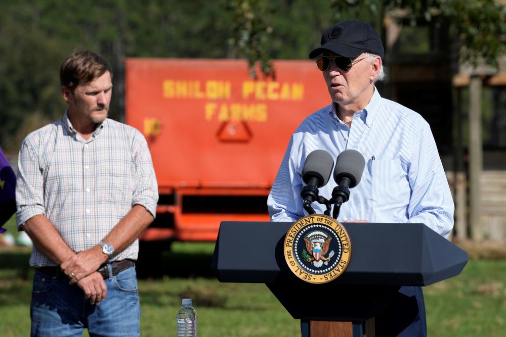 President Joe Biden speaks at Shiloh Pecan Farm as property manager Buck Paulk looks on in Ray City, Ga., Thursday, Oct. 3, 2024, as part of Biden's trip to see areas impacted by Hurricane Helene.