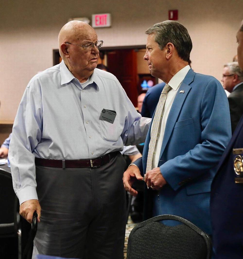 The late Cullen Talton, left, pictured alongside Gov. Brian Kemp. Talton served more than 50 years as Houston County’s sheriff. Gov. Brian Kemp/X (formerly Twitter).