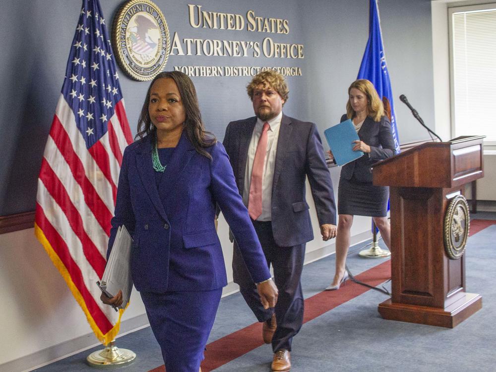 U.S. Assistant Attorney General Kristen Clarke leads U.S. Attorney Peter Leary of the Middle District of Georgia and U.S. Attorney Jill Steinberg of the Southern District of Georgia out of a downtown Atlanta conference room following a formal announcement of the DOJ's investigation into Georgia prisons.