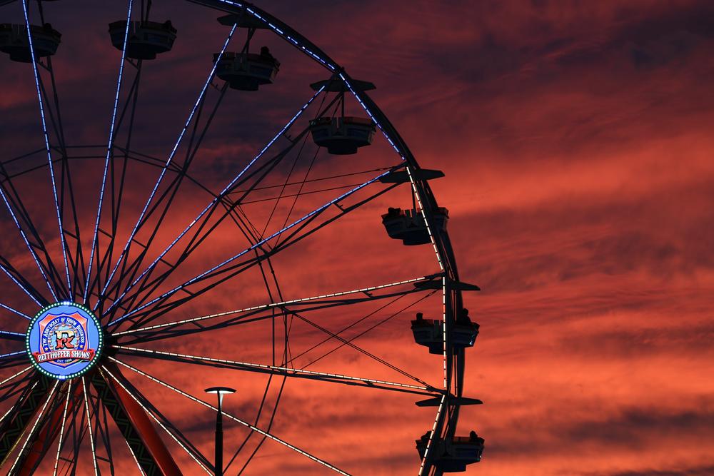 Fairgoers ride the ferris wheel at sunset at the Georgia National Fair in Perry, Ga., on Saturday, Oct. 9, 2024. (Photo/Margaret Bartlett)